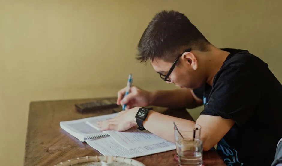 A notebook with grammar notes and language study materials — Photo by Min An on Pexels