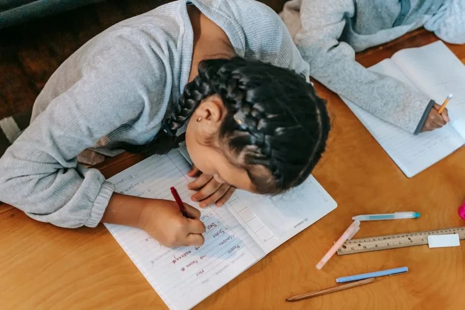 Student practising Polish case endings in a notebook — Photo by Katerina Holmes on Pexels