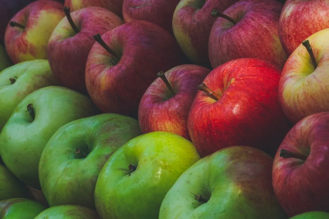 Red apple, yellow apple, and green apple side by side — Photo by N/A on Pexels