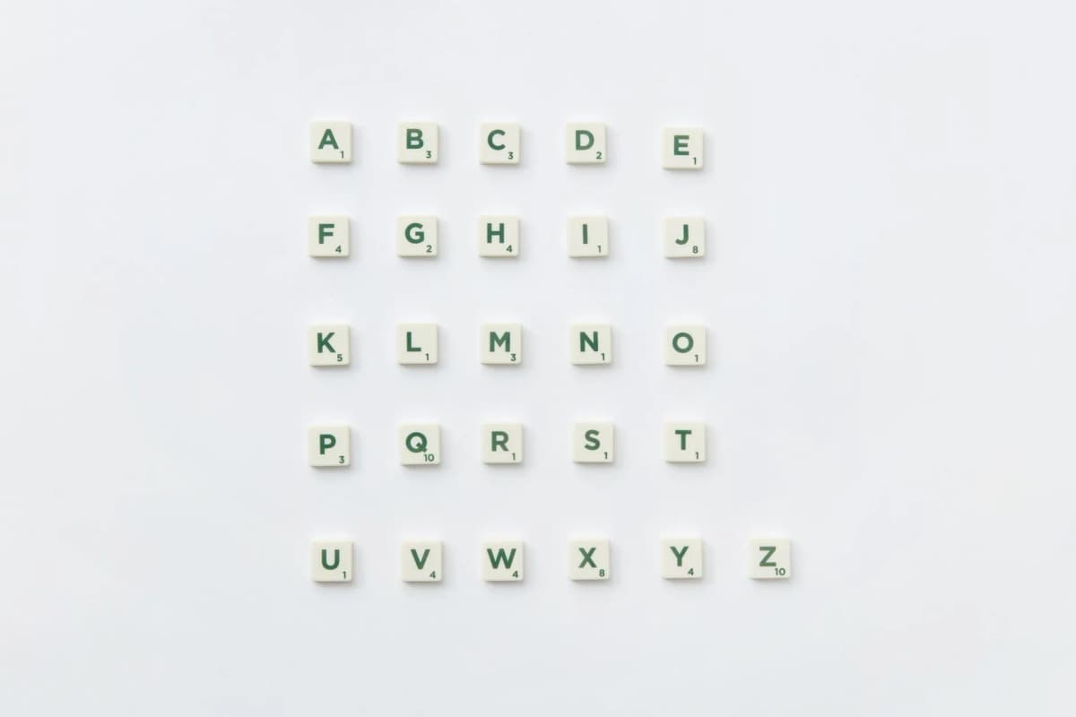 Scrabble letter tiles arranged into the alphabet — Photo by DS stories on Pexels
