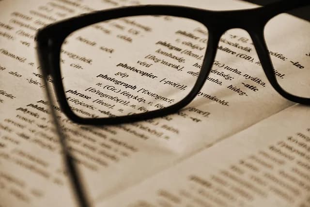 Glasses resting on an open dictionary page -- is Polish hard to learn for English speakers?
