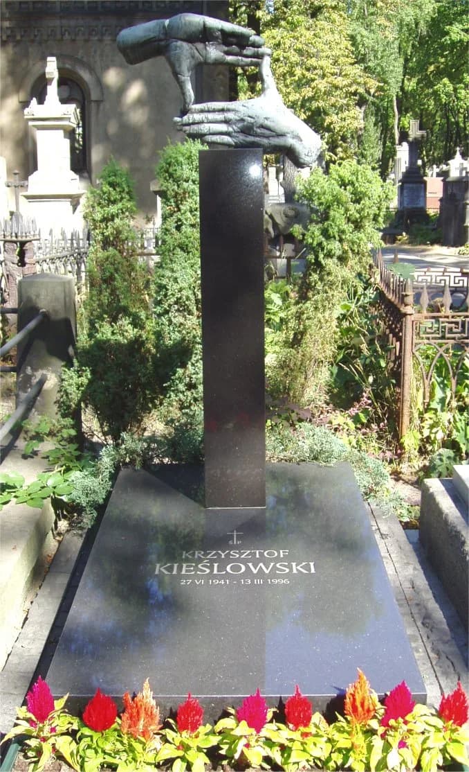 Krzysztof Kieślowski's grave marker at Powązki Cemetery in Warsaw, bearing his name and dates
