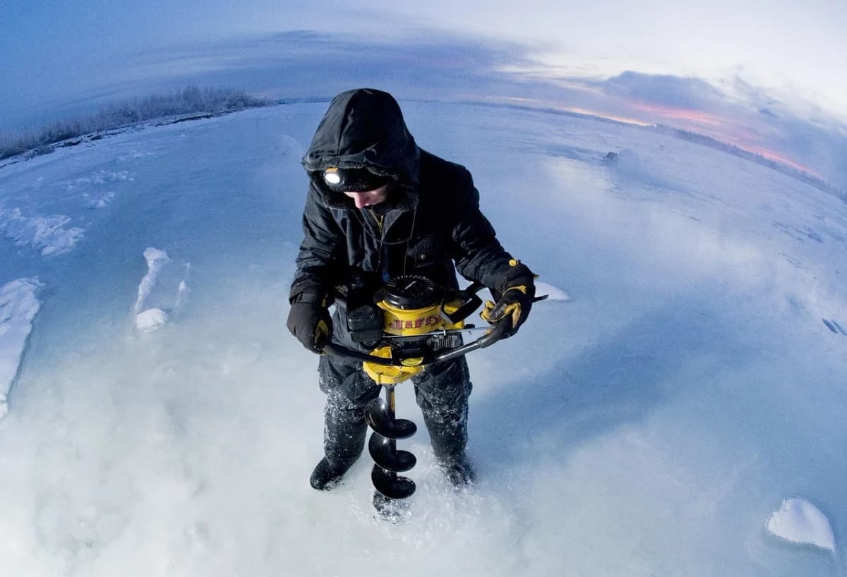 A hole cut into thick lake ice with an ice auger, similar to the przerębel used by Polish winter swimmers