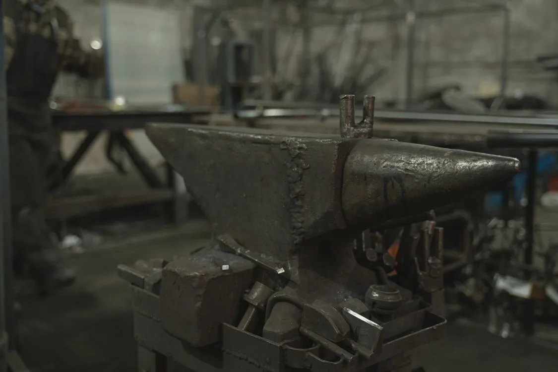 Traditional Polish blacksmith working with metal at a forge — Photo by N/A on Pexels