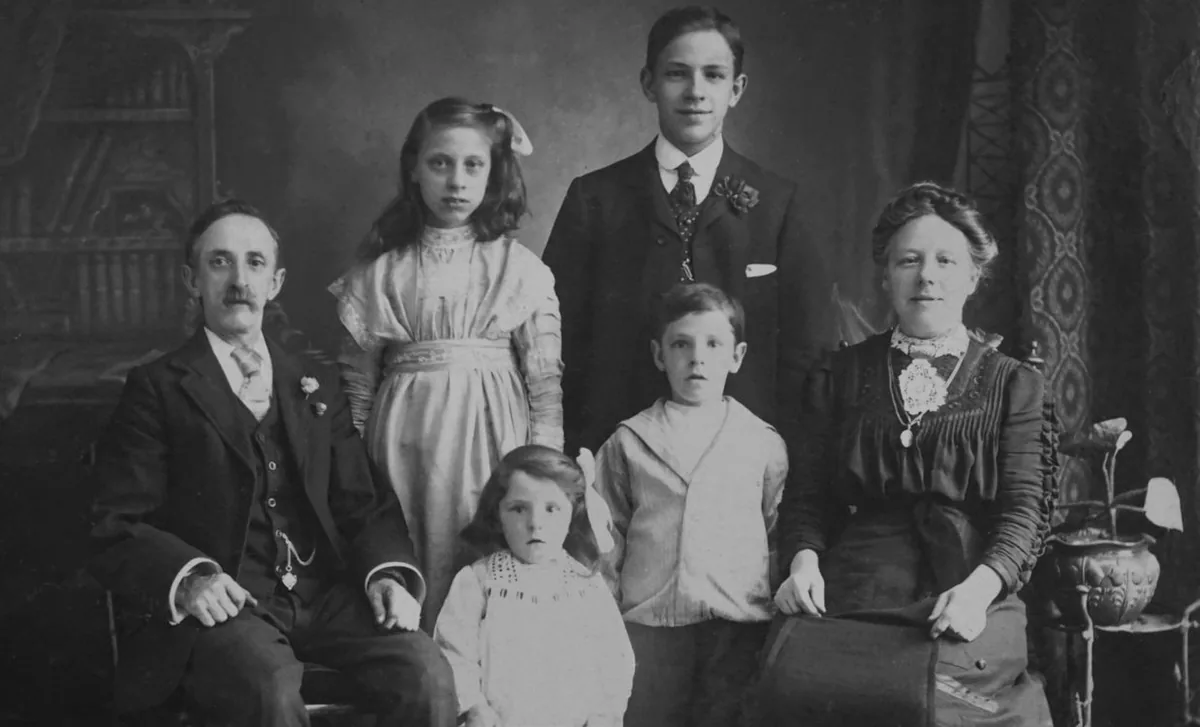 Vintage black and white portrait of a Polish family showing traditional attire