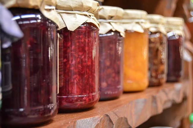 Nalewka polish liqueur jars steeping fruit in vodka on a windowsill