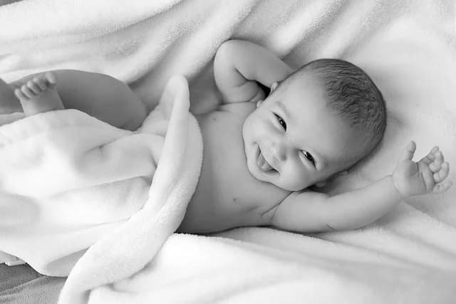 Newborn baby wrapped in a soft blanket, representing the choice of Polish baby names
