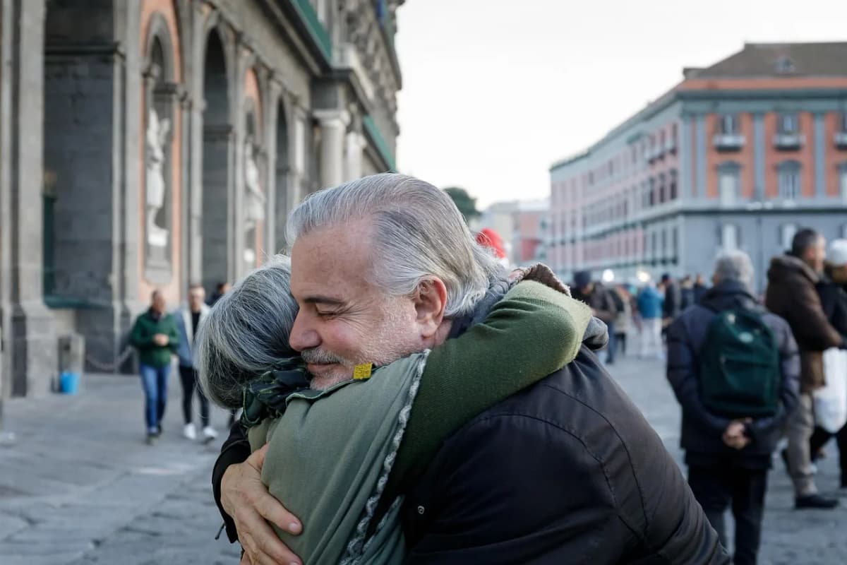 Two old friends embracing on a city street