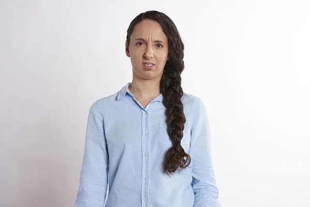 Confused woman thinking, representing the moment Polish false friends trip up a learner