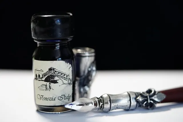 An antique quill pen and bottle of ink, evoking the poetry and letters that helped keep Polish alive in exile