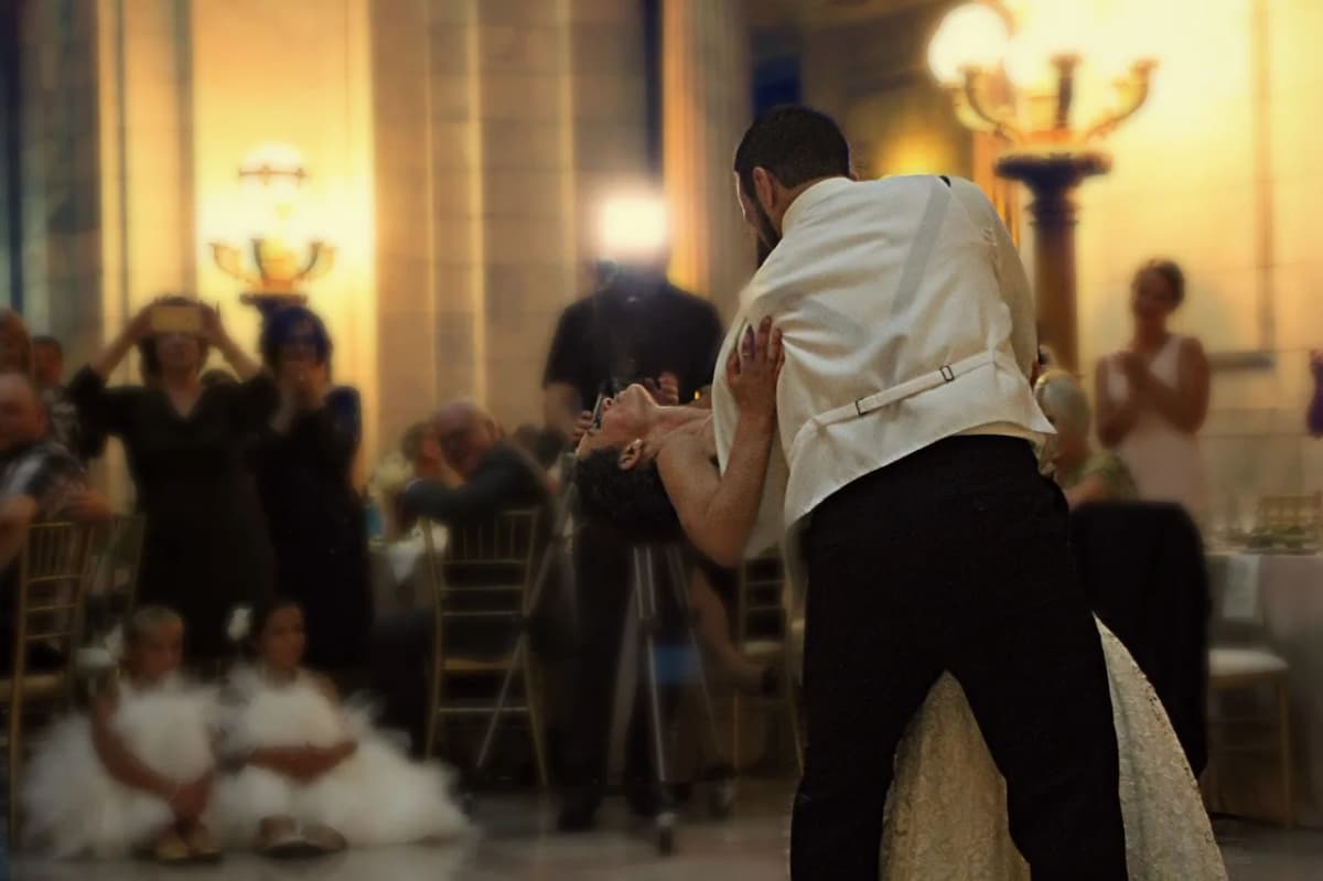 Newlyweds dancing at their wedding reception, part of the celebration that follows the ceremony at a Polish wedding