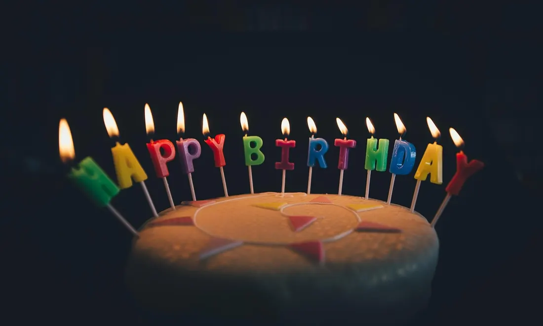 Birthday candles spelling out a celebration message -- the moment Poles break into the sto lat song