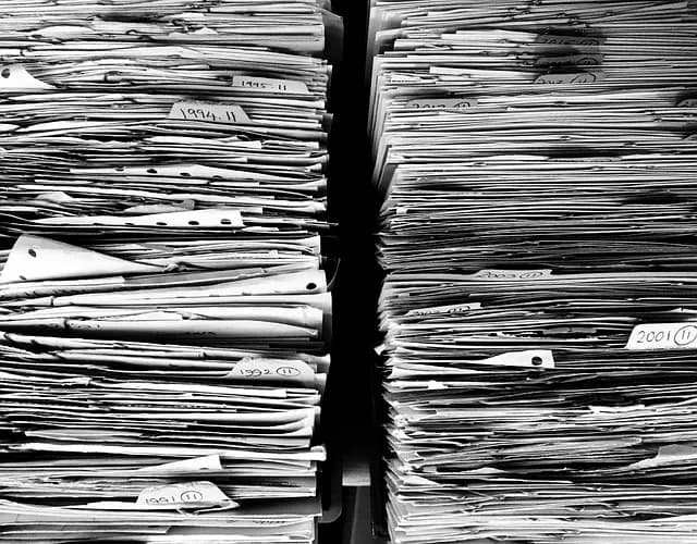 A stack of paperwork and official forms, the kind of bureaucracy Poles describe navigating with zalatwic