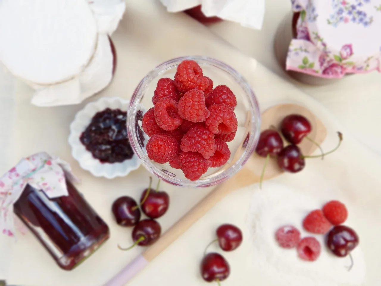 Cherries and berries boiling down in a pot, the traditional method for making kompot