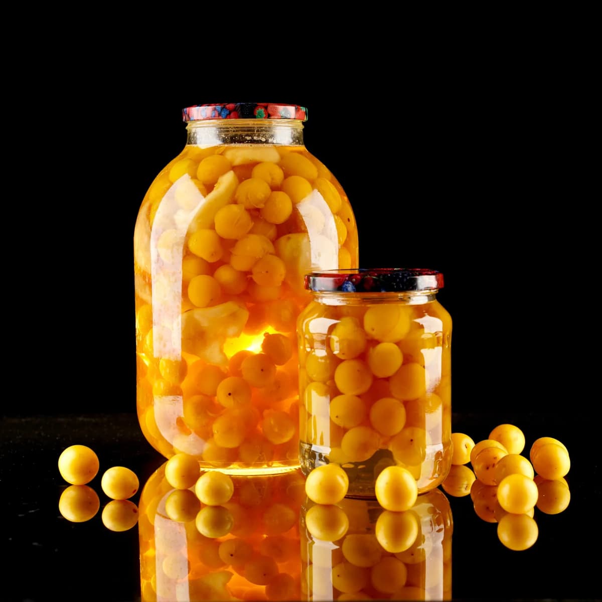 Jars of preserved mirabelle plums, similar to how kompot fruit is stored