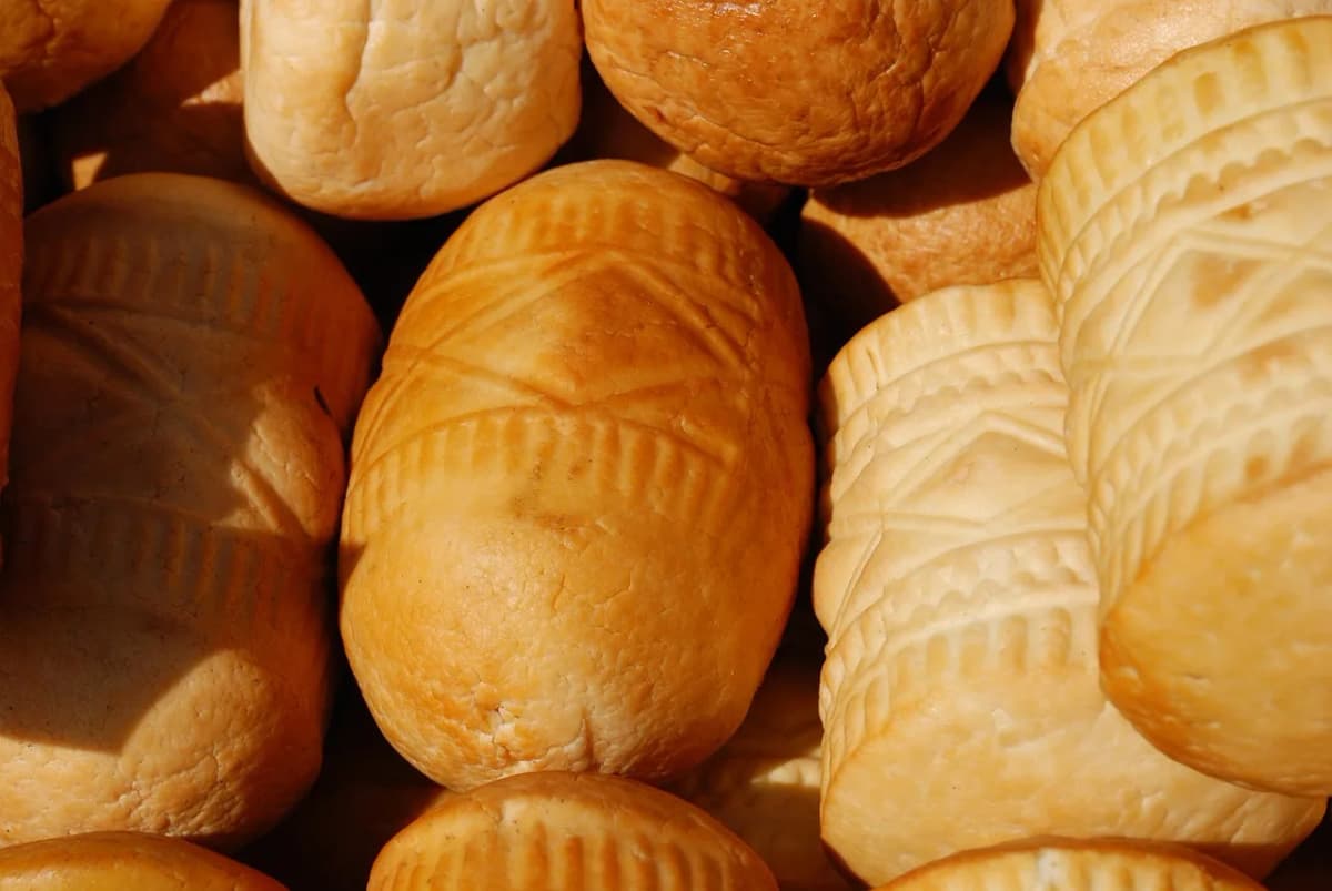 Traditional spindle-shaped oscypek cheese with hand-carved decorative patterns