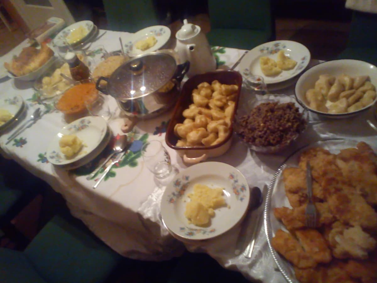A traditional Polish Christmas Eve (Wigilia) table set with festive holiday dishes