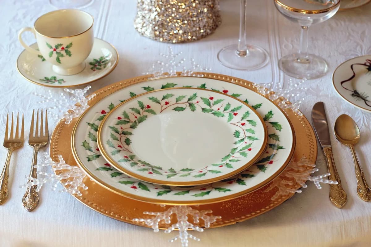 An elegant holiday table setting with festive china, ready for a multi-course Wigilia meal