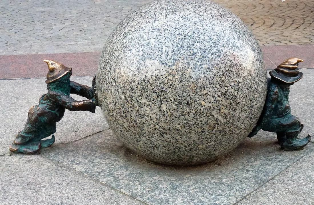 The Krasnale Syzyfki, a pair of Wroclaw gnomes eternally pushing a giant granite stone