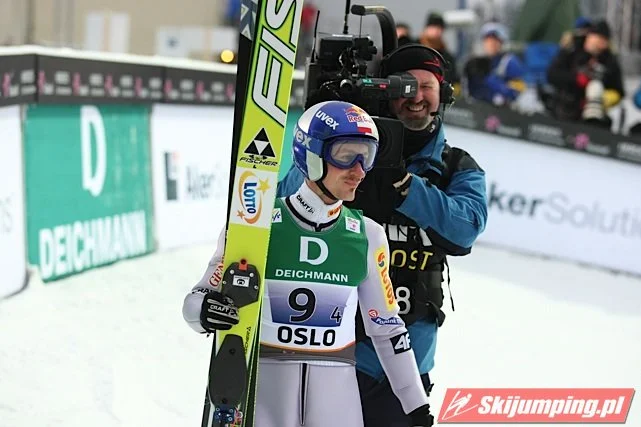 Adam Malysz with a TV cameraman during a competition in Oslo, 2011, reflecting the intense media attention of the Malyszmania years