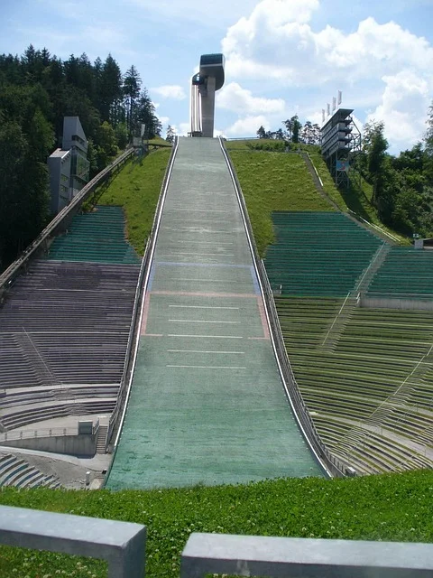 Ski jump hill and scoreboard against a winter sky in Poland
