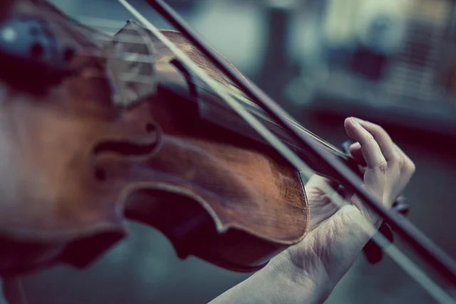 A violinist performing, in the tradition of Gorale highland string ensembles