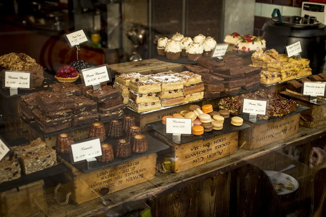 A bakery display case filled with fresh cakes and pastries
