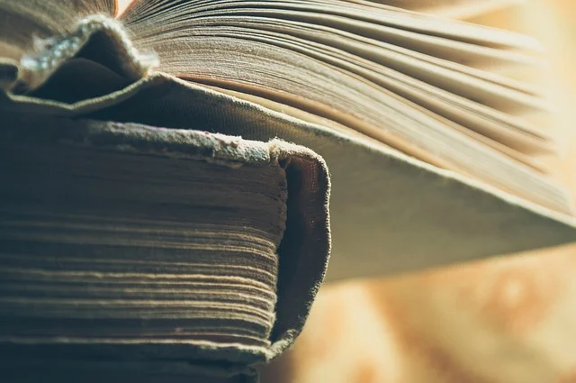Stack of old library books representing Stanislaw Lem's literary output