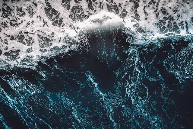 Aerial view of ocean waves representing the sentient ocean in the Solaris novel