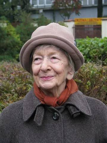 Wislawa Szymborska smiling and wearing a hat, photographed in Kraków in 2009