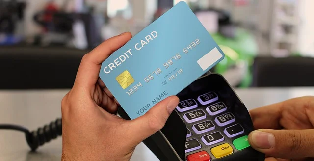 Close-up of a hand entering a six-digit BLIK code on a payment terminal keypad