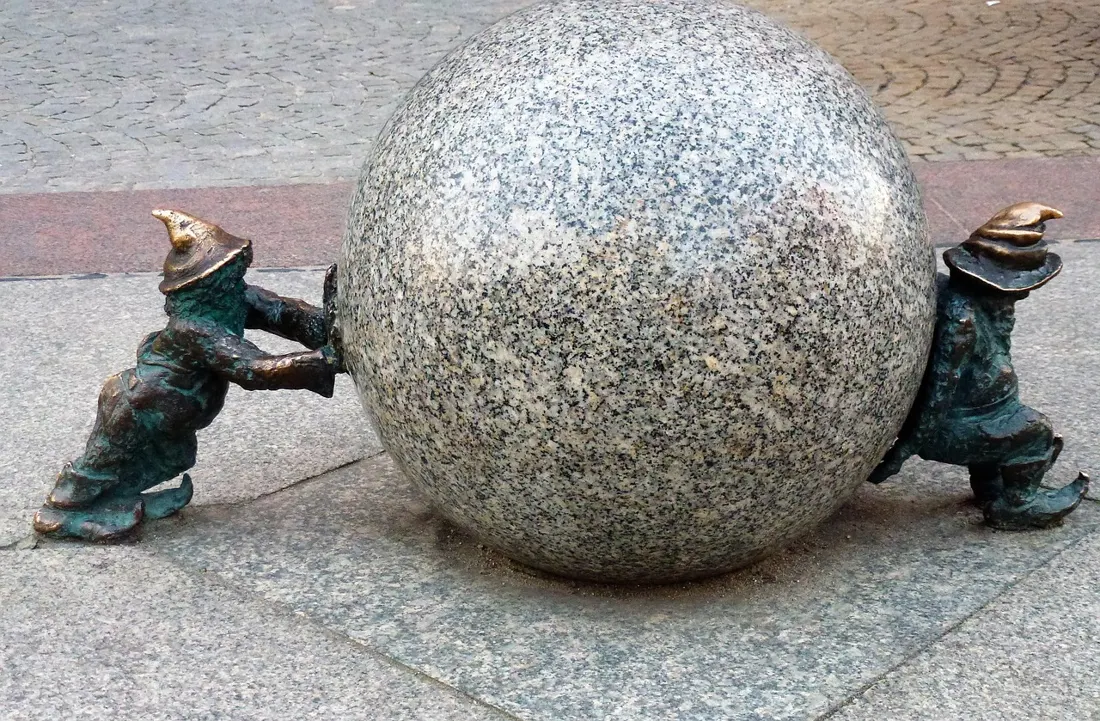 The Krasnale Syzyfki, a pair of Wroclaw gnomes eternally pushing a giant granite stone